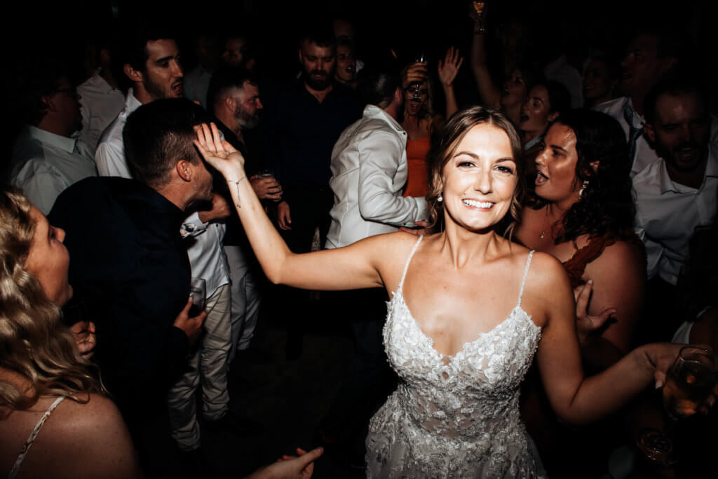bride facing photographer having the time of her life