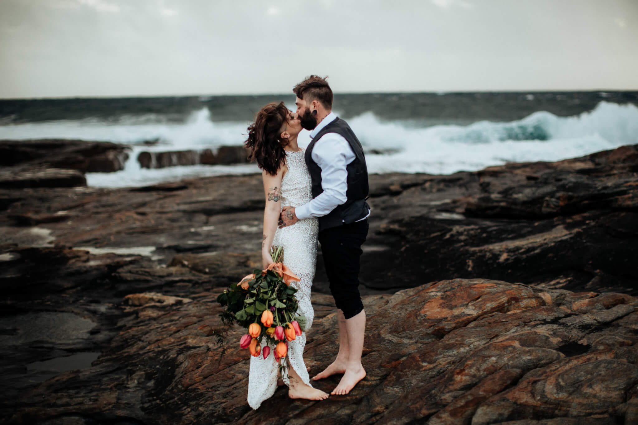 Newlyweds kissing on Gracetown Beach in Margaret River